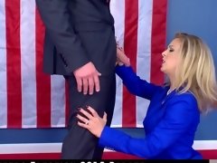A blonde does a blow job during a political debate in this video