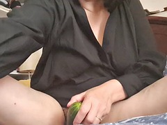 Wife puts cucumber deep in pussy