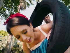 Young girl does it with man on a public parc tire swing