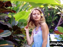 Nude blond hair girl enjoying the pool outdoor