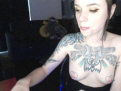 tattooed webcam damsel inhales and gags on dildo