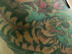 Tattooed mistress pegging her submissive