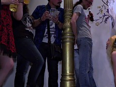Blonde sub gets double penetration in public bar