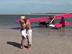 Passionate fuck on the beach with a stunning blonde with big tits