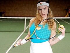 Alice Klay headband on, sneakers up, she spreads on the green court