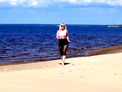 Jokey cougar with nylon caboose and breasts on beach