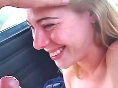 Cute blonde sucks a cock during a car ride
