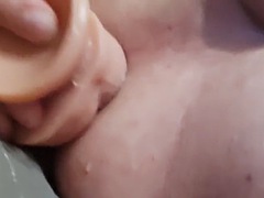 Bonnie jerks off her ass with a thick dildo