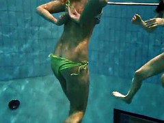 Two sexy amateurs showing their bodies off under water