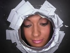 A nasty chick is licking and fucking five dicks inside a glory hole