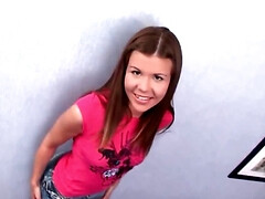 Foxy girl talks dirty while fingering her butt on the couch